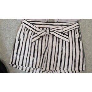 Lucid pink shorts m black white striped shorts.  tie bow in front or back.